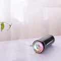 Black portable USB rechargeable humidifier with colourful LED lights and compact design for car or desktop use