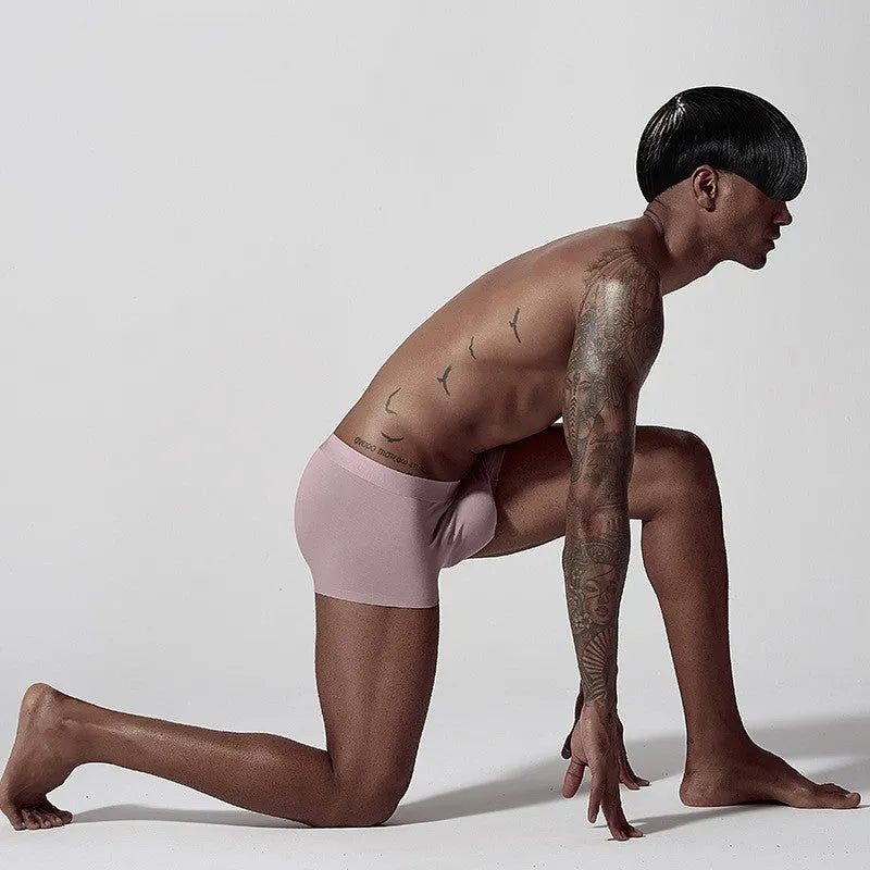 Men's seamless modal underwear in mid waist style showing hip lifting and body shaping design