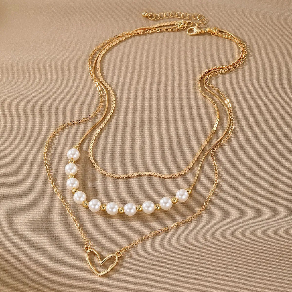 Vintage gold necklace with heart pendant on pearl chain, adjustable 41-50cm length