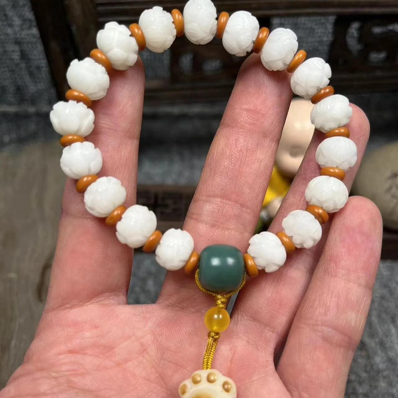 Carved pumpkin lotus bodhi root bracelet with white jade segments and golden silk jade treasures
