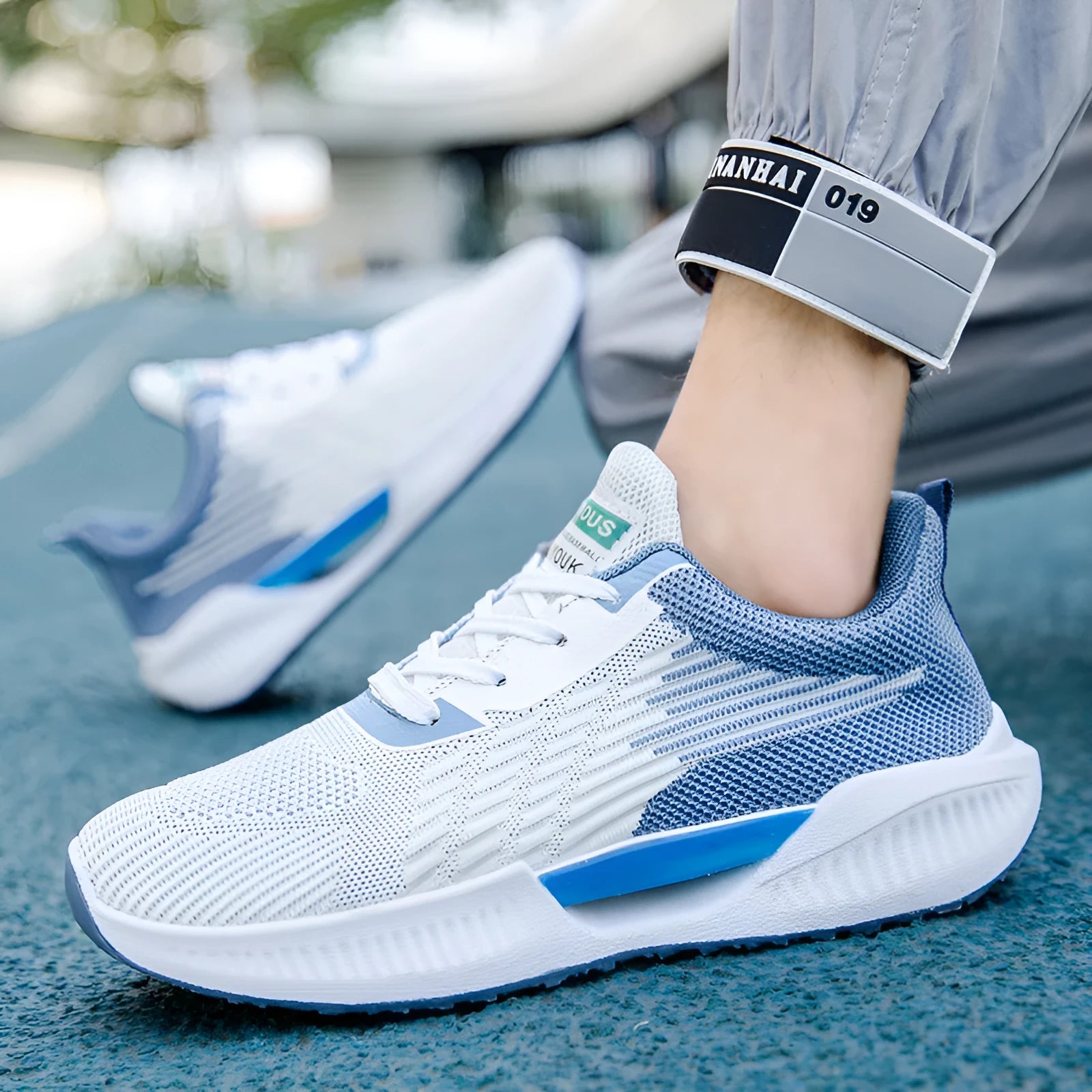 Men's blue casual mesh sports shoes with a round toe and cloth upper on a white background.