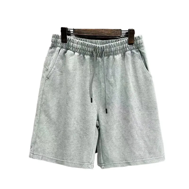 Men's cotton distressed shorts in loose fit straight-leg design
