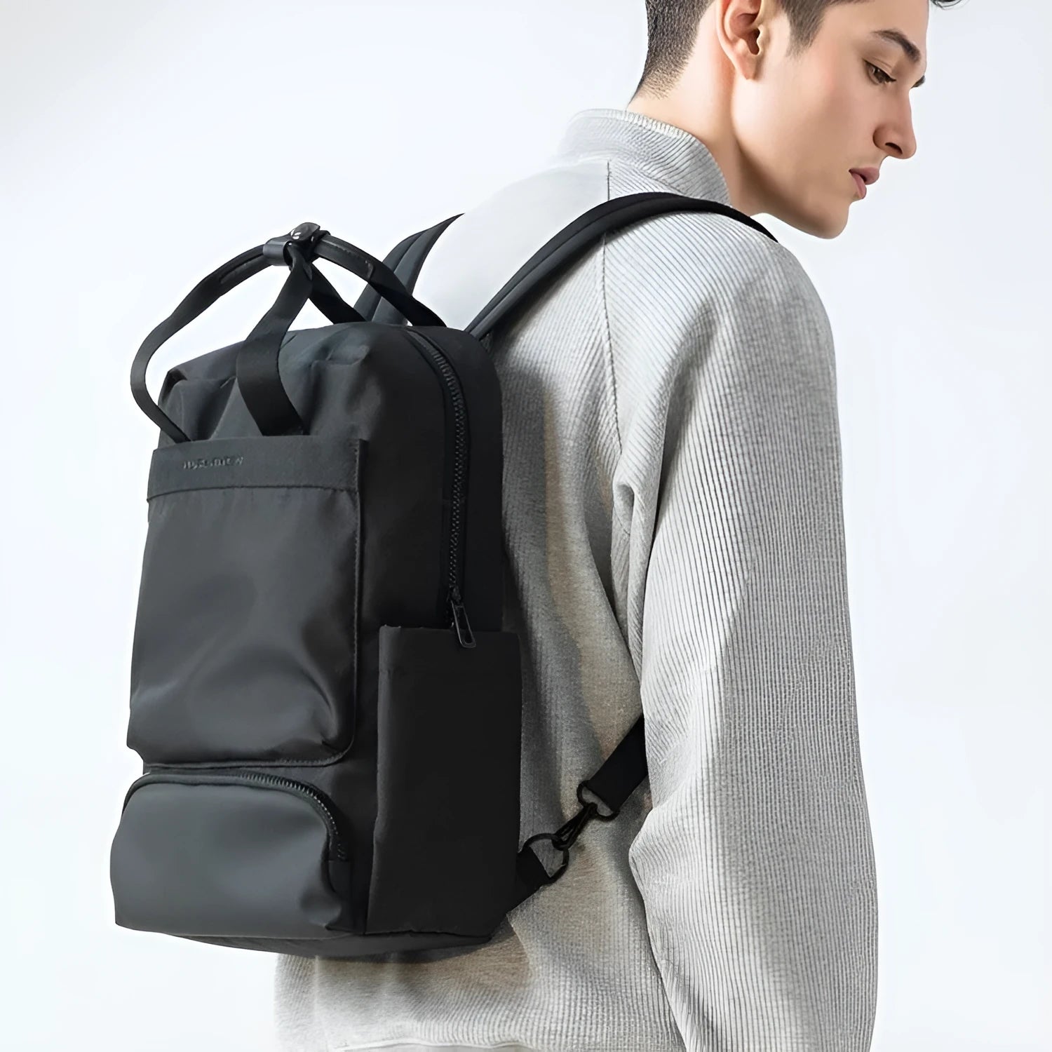 Black Oxford cloth laptop backpack with 20-35L capacity and multiple storage compartments