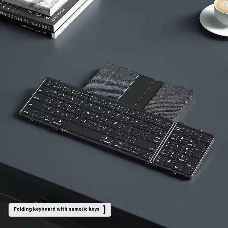 Black folding Bluetooth keyboard for mobile phones and tablets showing compact 346mm size