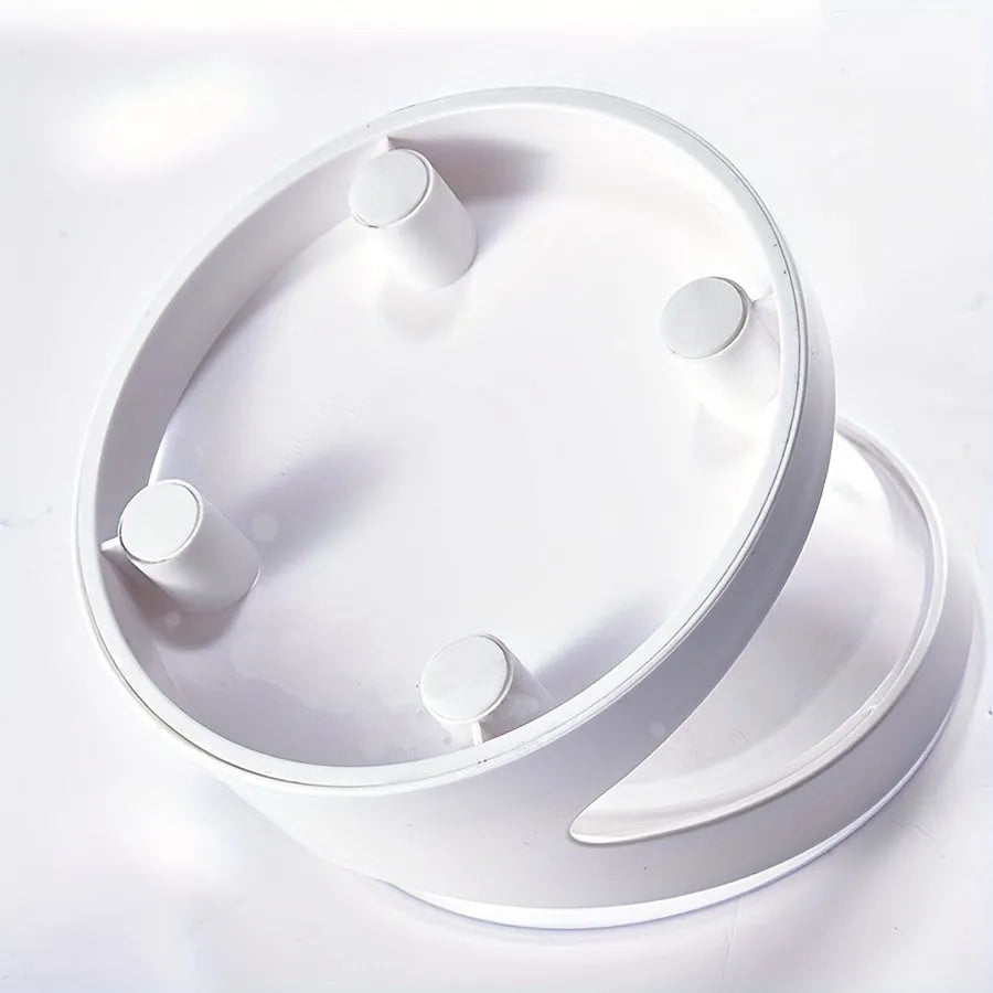 Clear plastic tilted cat food bowl on a flat surface