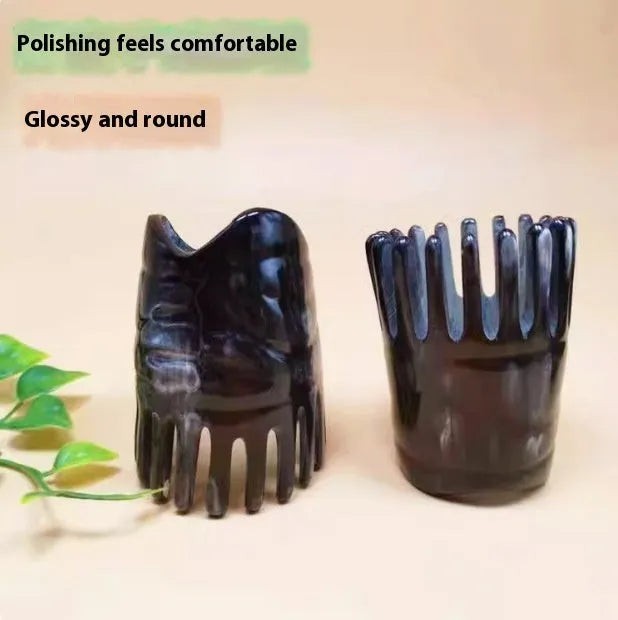 Black buffalo horn head massage comb with wide-tooth, pointed tip, and fine-tooth sections