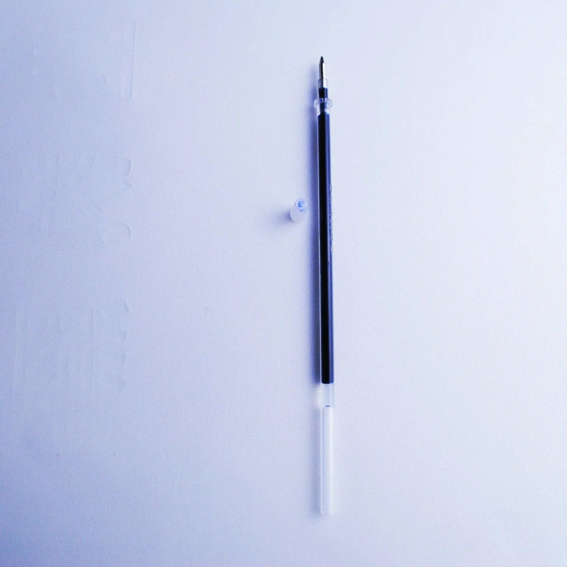 Blue automatic fading pen set with 0.5mm tip, plastic body, and eight refill cores.