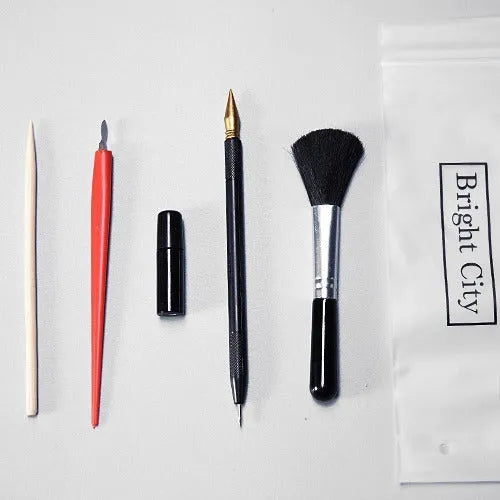 Scraping painting tools kit with white card paper, scraping pens, brushes, and art accessories for scratch artwork