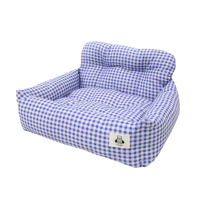 Car-mounted pet travel nest in stain-resistant cloth with grey or blue plaid options