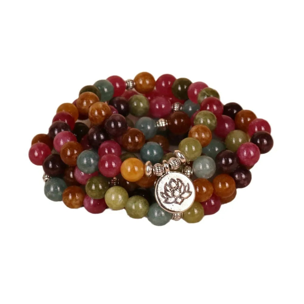 Multi-layer bracelet with 108 beads, a lotus charm, in Tourmaline-coloured alloy.