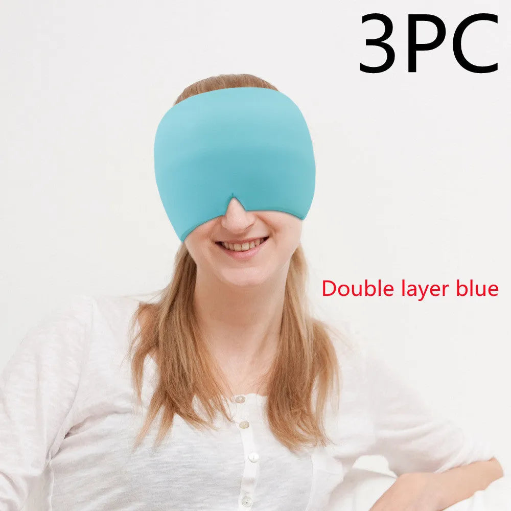 Black elastic cloth gel cold therapy eye mask for headache relief on grey background.