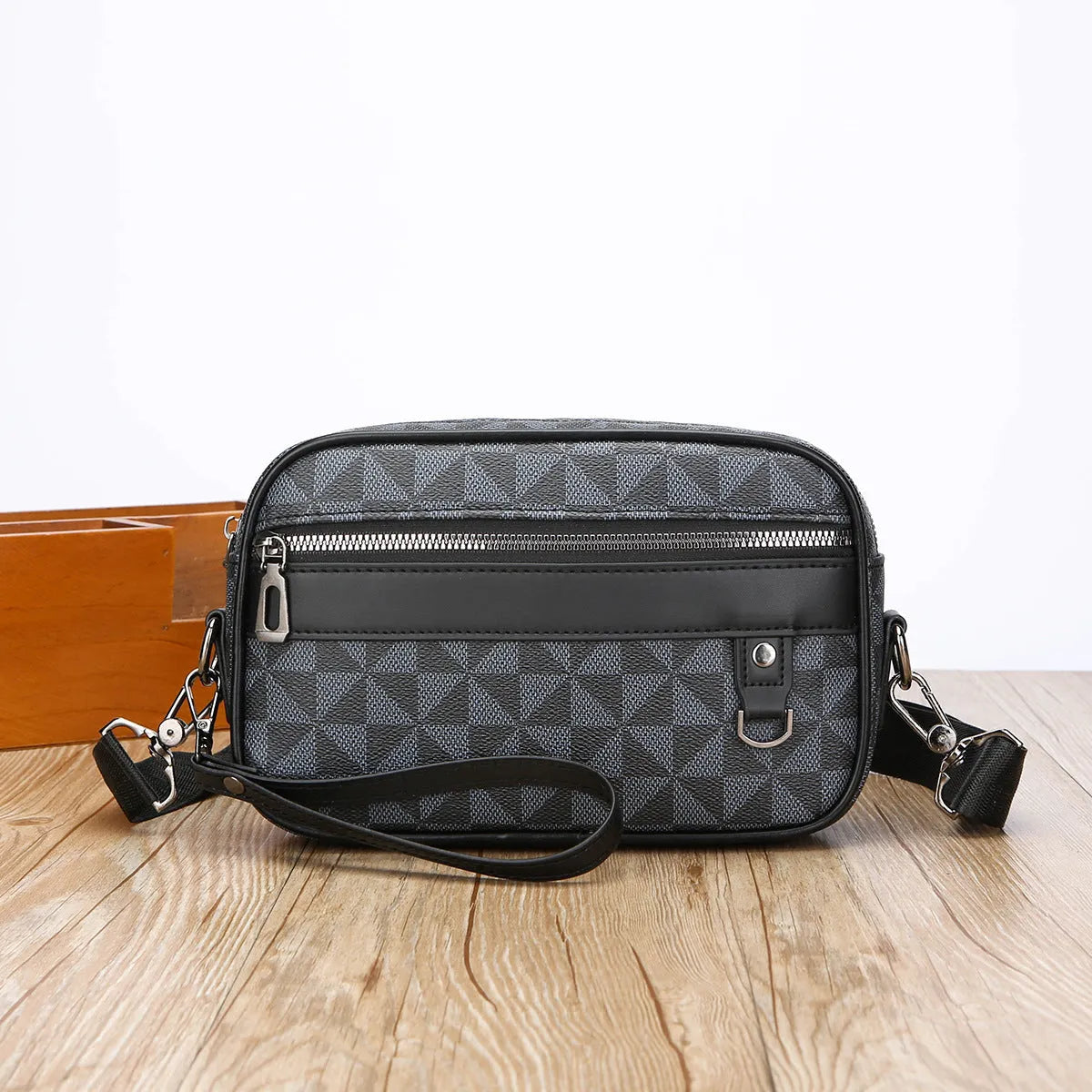 Men's geometric pattern PU messenger bag shown in a horizontal carry position.