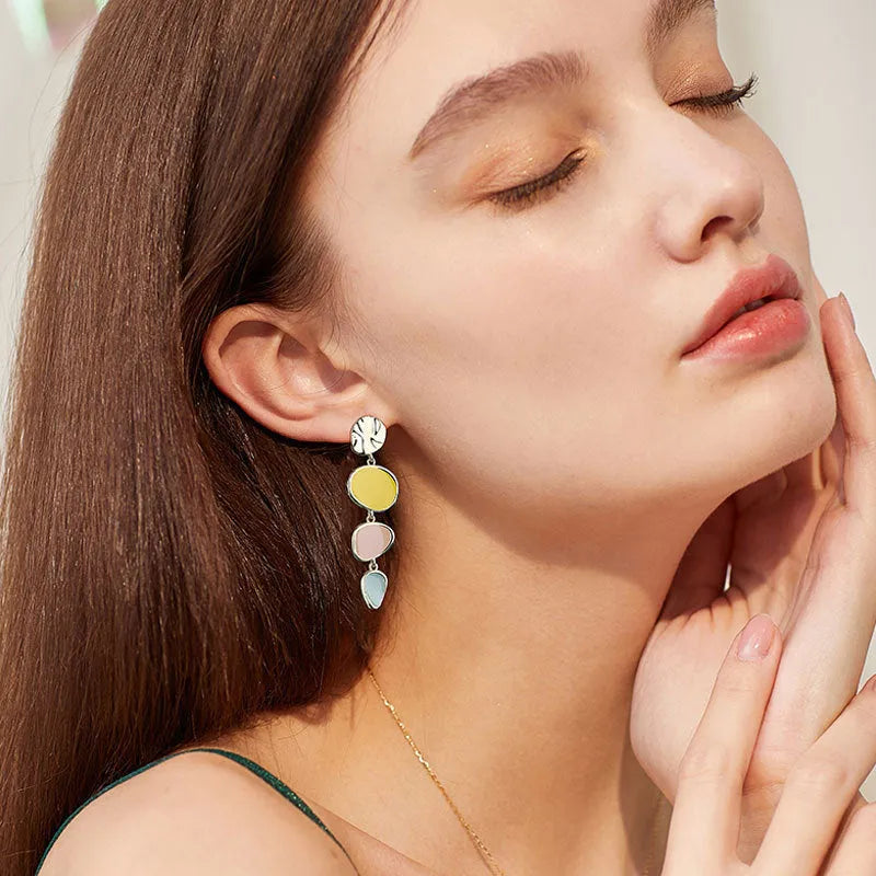 Pair of simple alloy disc earrings with a Morandi three-colour oil drip finish and sterling silver posts.