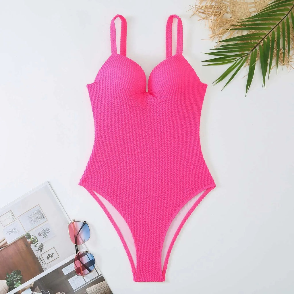 A women's sleeveless one-piece swimsuit on a hanger, shown in black, with other colour options available.