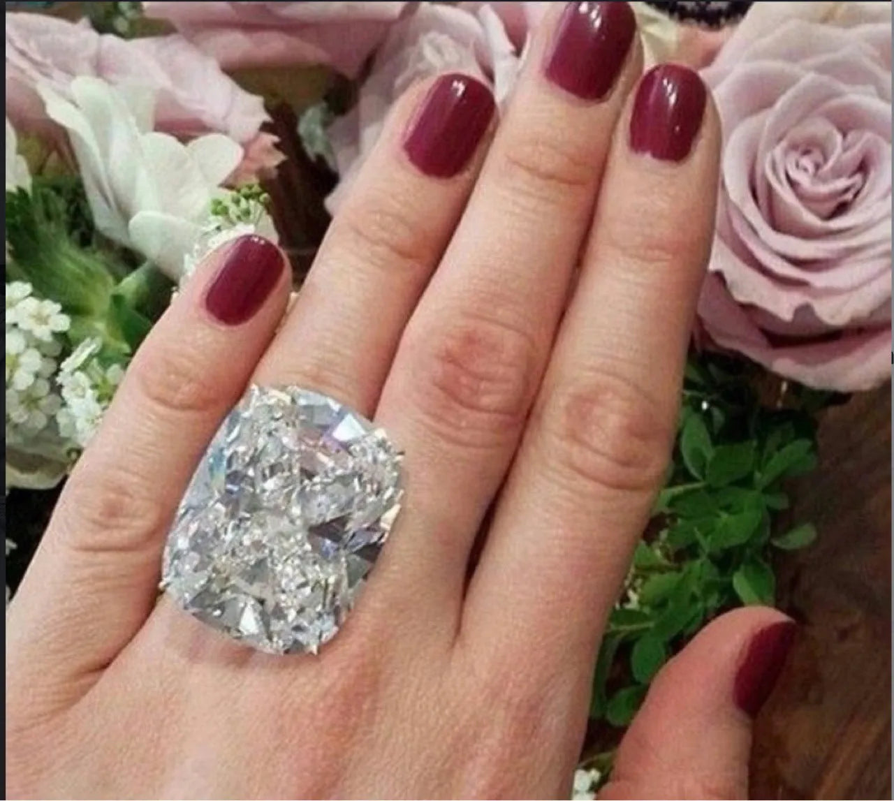 Women's simple geometric alloy ring with a square diamond inlay in white gold colour, shown on a finger.