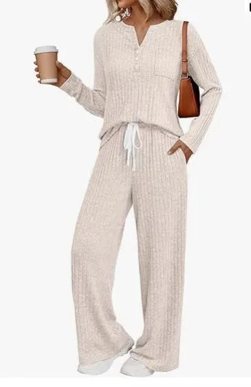 Women's striped knit V-neck long coat in light grey with matching pants, showing lace-up details