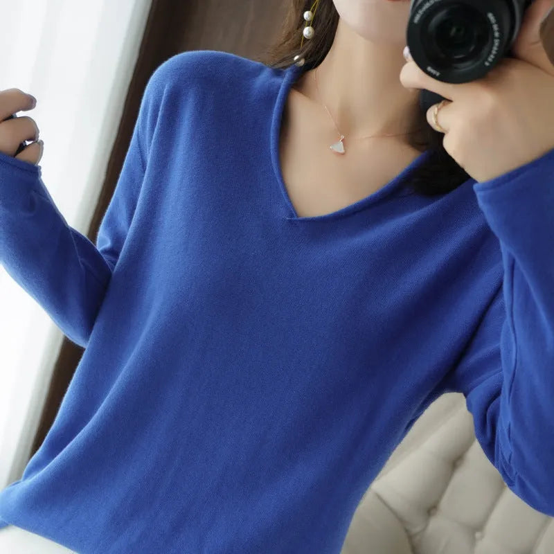 Women's long sleeve V-neck knitwear pullover top in a choice of ten colours on a hanger.