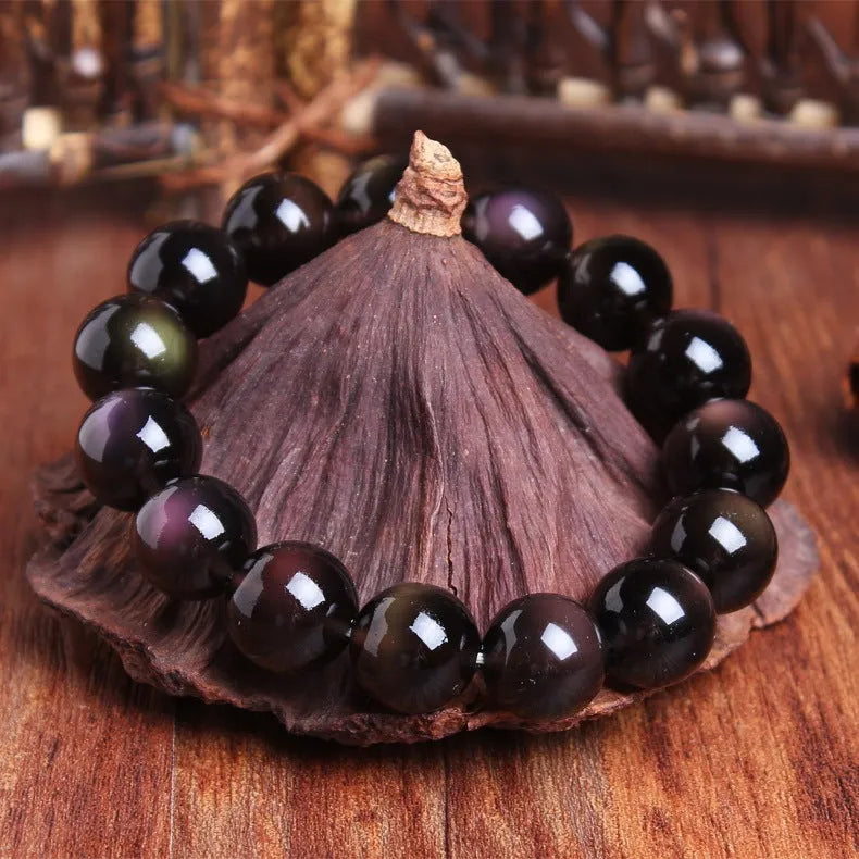 A geometric polished crystal bracelet featuring a Pi Xiu charm on a beaded strand.