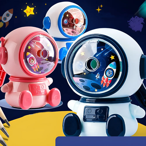 Blue and pink cartoon astronaut model manual pencil sharpener for children on a desk.