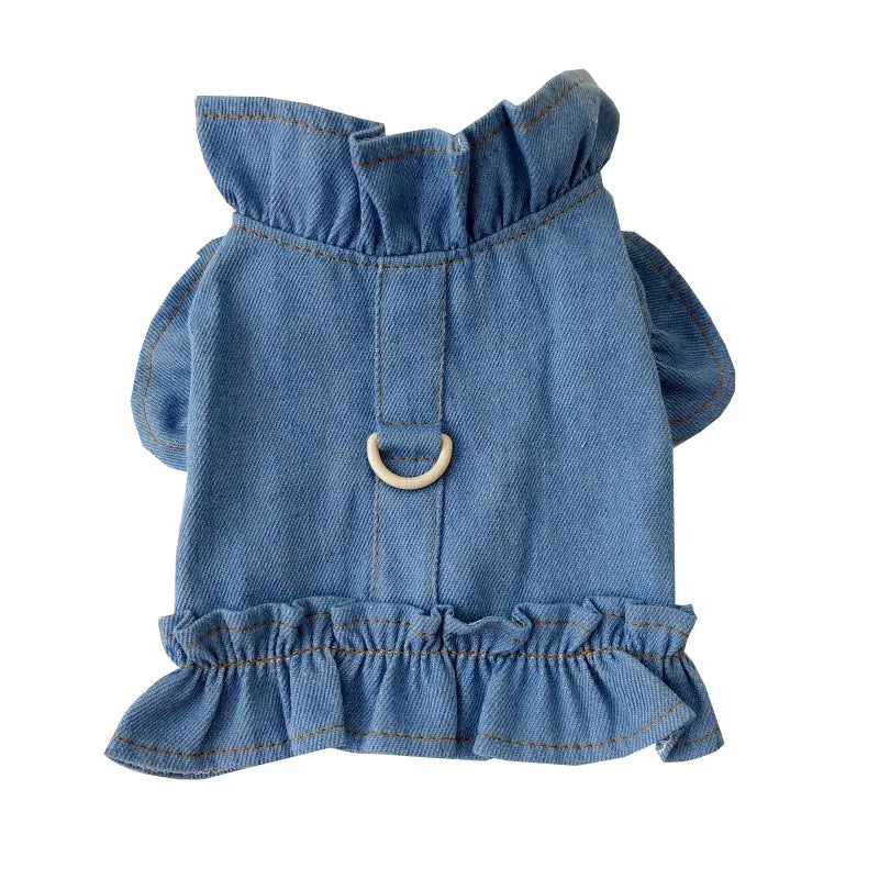 Blue denim dog dress with ruffles and integrated leash hooks on the chest and back.