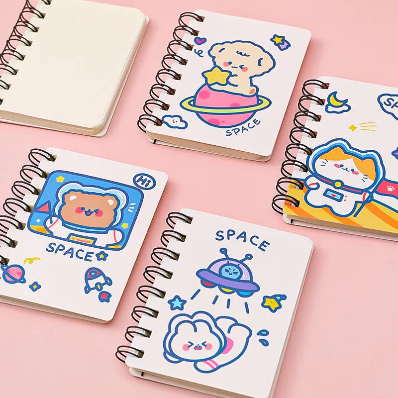 Astronaut-themed pocket notebook with flip closure showing 10.5 × 8 cm dimensions