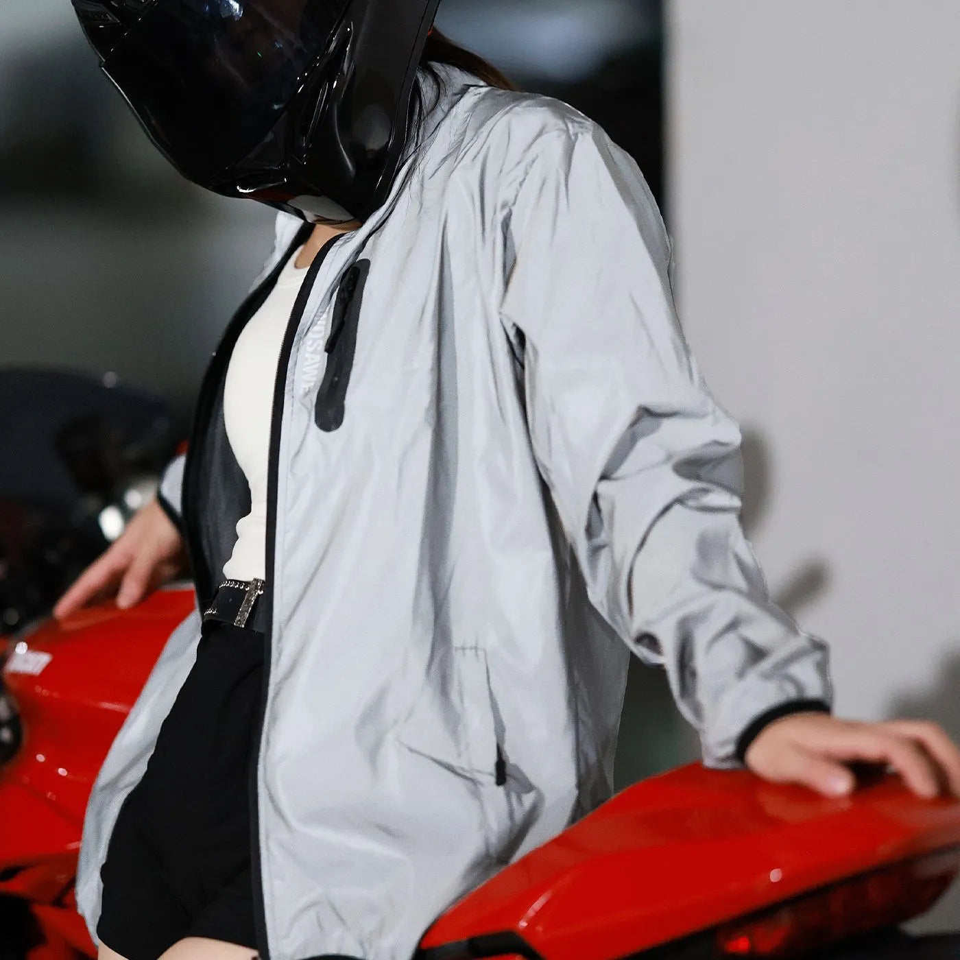 Silver waterproof polyester long sleeved windproof coat showing front design.