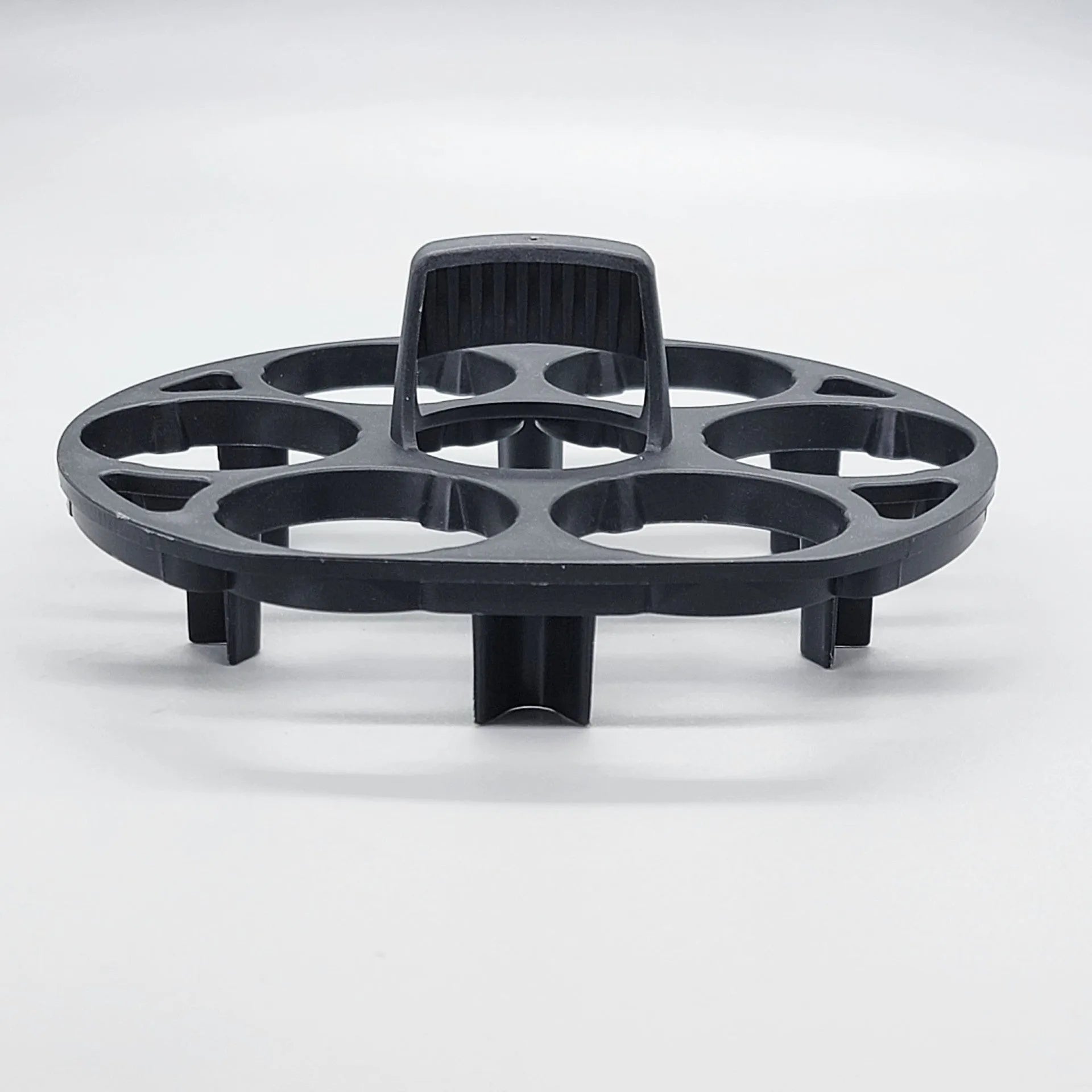 Black plastic egg holder basket with dimensions 13.8 by 12.6 cm.