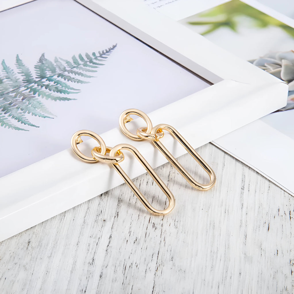 Geometric sterling silver needle hoop earrings with line and ring design elements