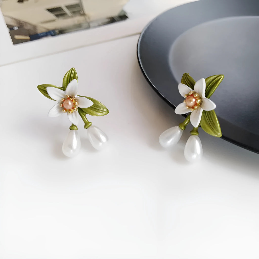 Women's alloy flower earrings with sterling silver needle design and clip-on alternative