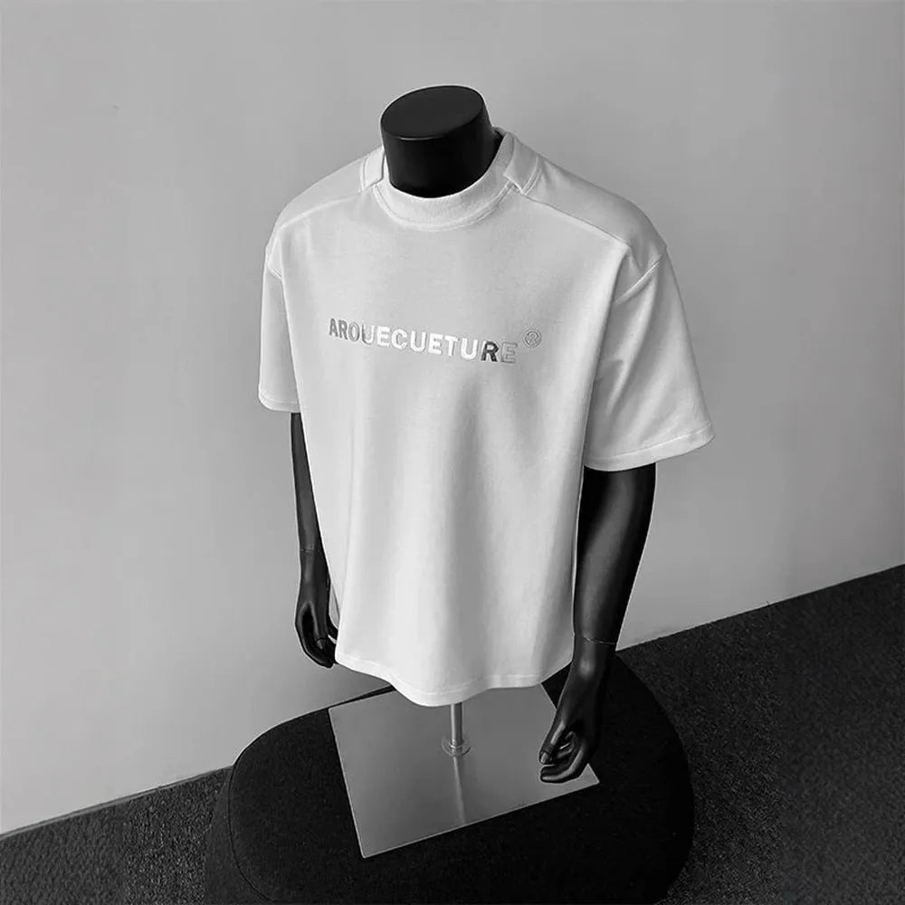 Men's white short sleeve cotton t-shirt with printed letters showing loose fit pullover style