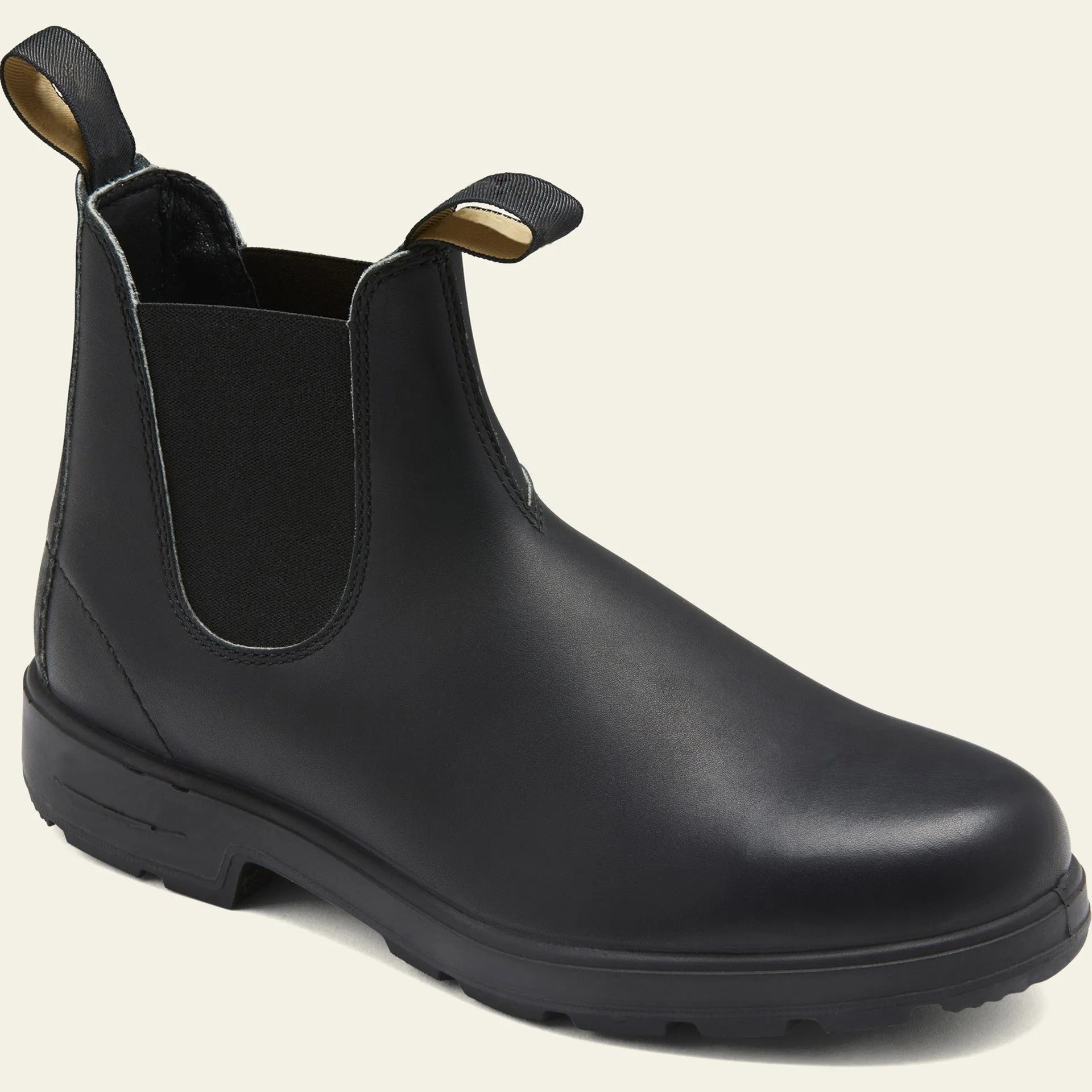 Unisex vintage brown Chelsea boots with a chunky sole and round toe on a white background