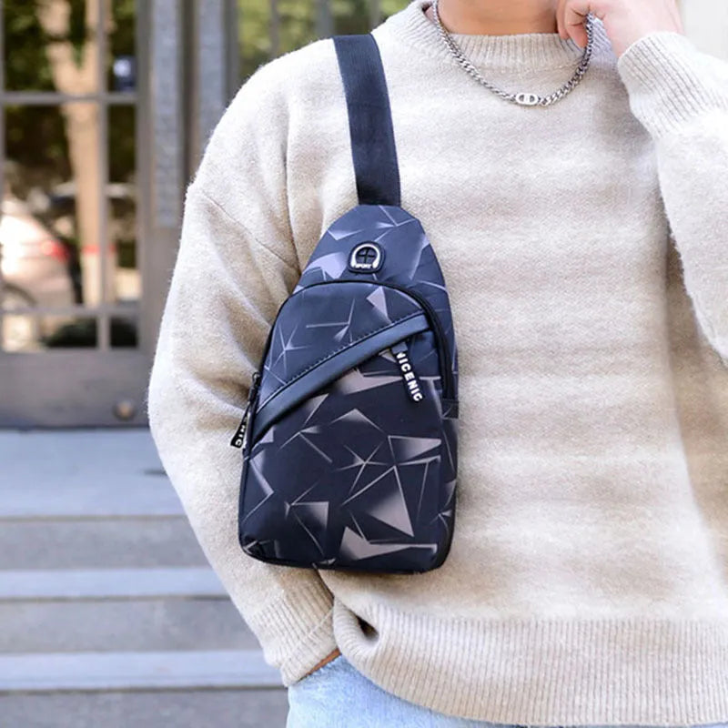 Men's Oxford cloth sling chest bag with earphone hole showing crossbody strap and zipper closure