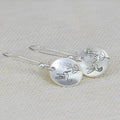 Silver retro bird motif glossy round women's earrings with leaf designs