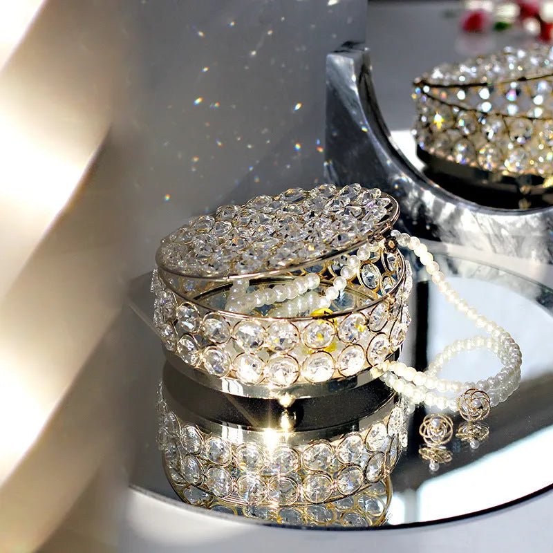 French gold metal jewellery box with a transparent crystal glass lid for storing rings and necklaces.