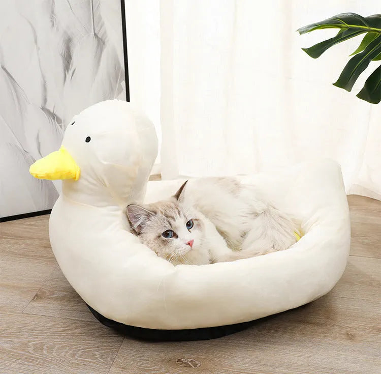 Blue duck-shaped pet bed sofa for small dogs and cats on white background
