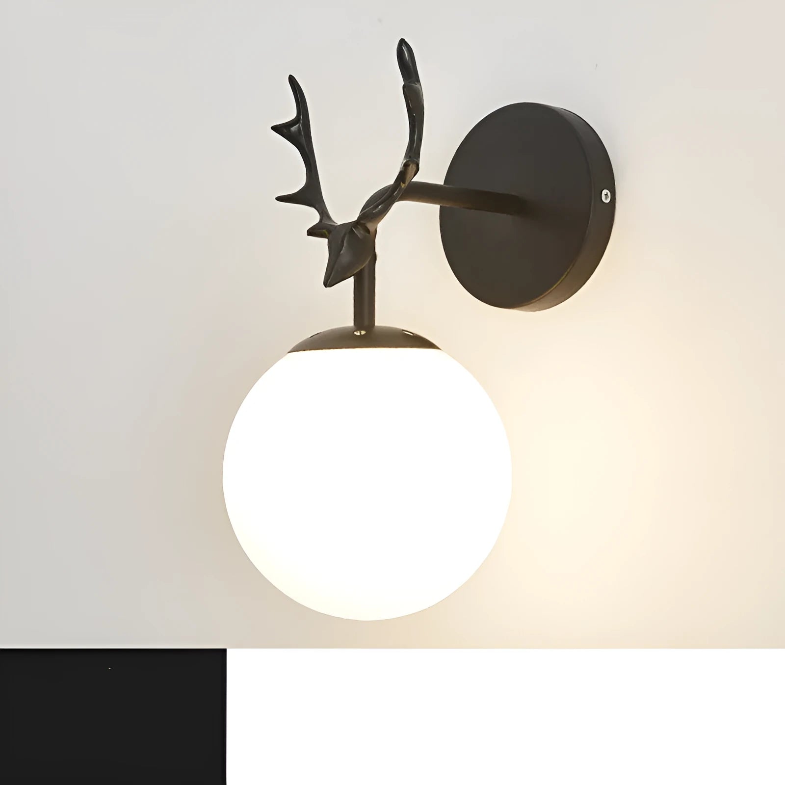 Modern round glass wall lamp with Nordic minimalist design on a wall.
