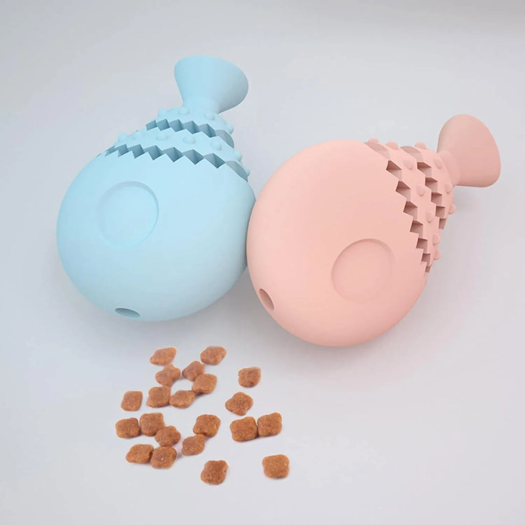 Blue green pink fish bone shaped dog chew toy with treat hole for dental cleaning.