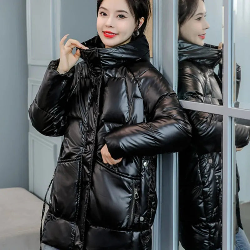 Women's loose fit winter hooded jacket in black colour with regular sleeves
