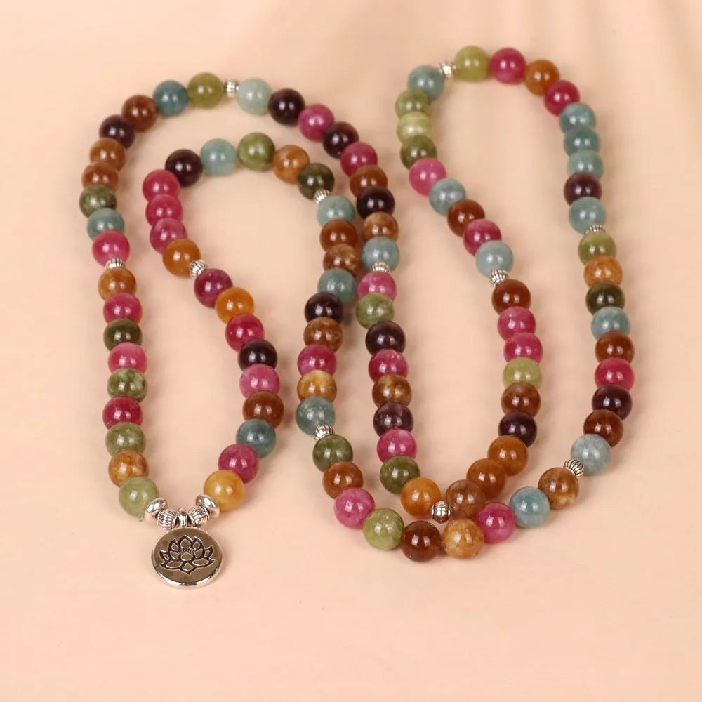 Multi-layer bracelet with 108 beads, a lotus charm, in Tourmaline-coloured alloy.
