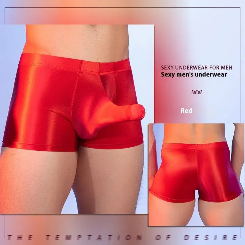 Men's red boxer shorts with a seamless nylon build and a printed elephant nose design on the front.