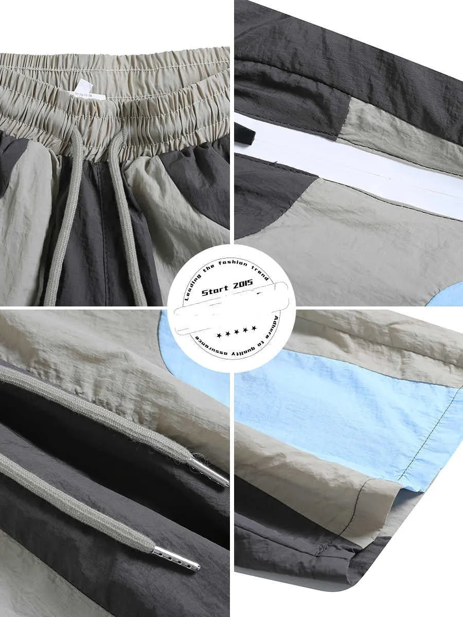 Blue patchwork men's sports shorts with loose straight-leg cut and elastic waist