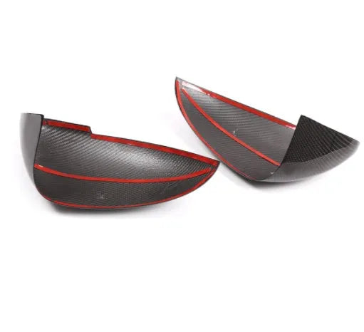 True carbon fibre rearview mirror cover for Porsche Macan, showing black woven pattern.