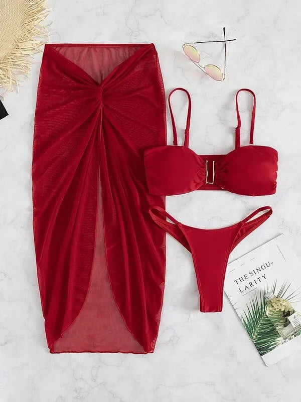 Women's multicolour French-style three-piece bikini set with a long culotte skirt on a hanger.