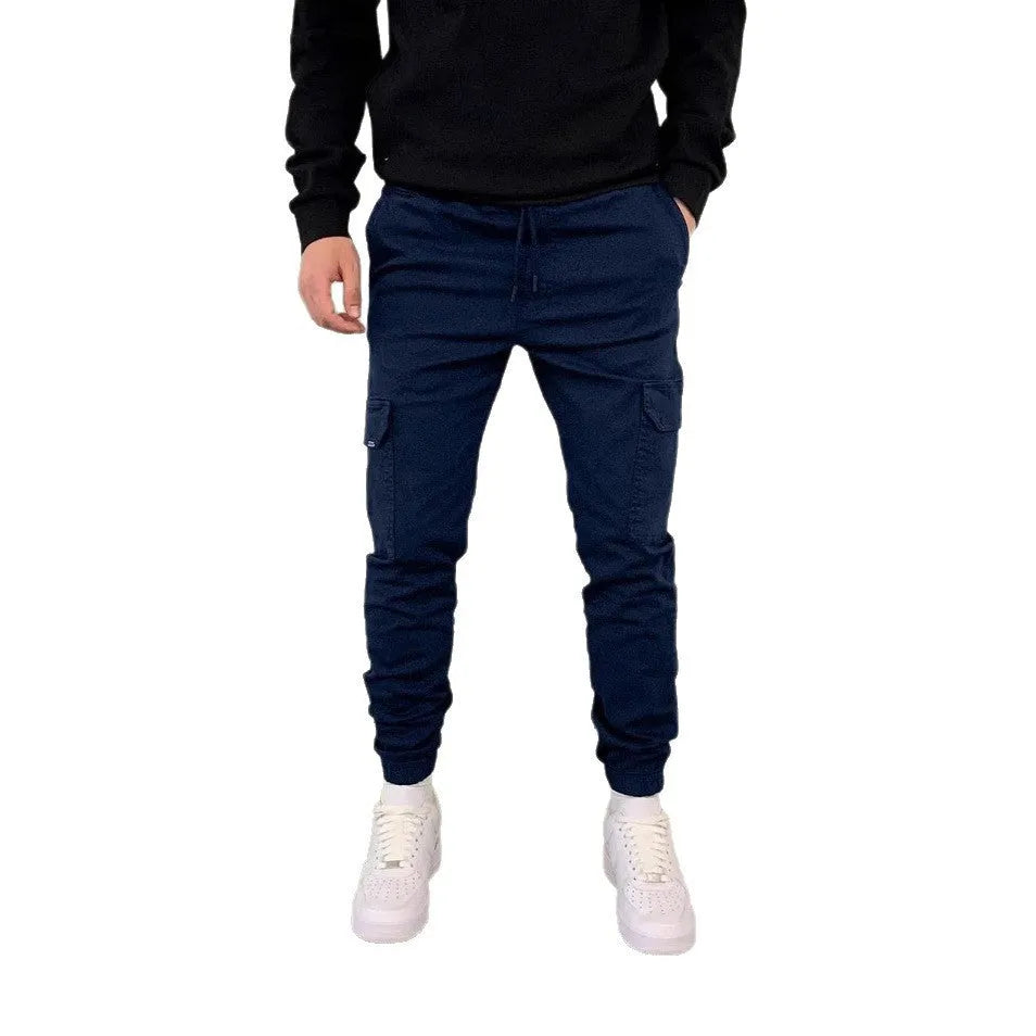 Men's loose-fit polyester casual trousers with elastic waistband and patch pockets in army green colour