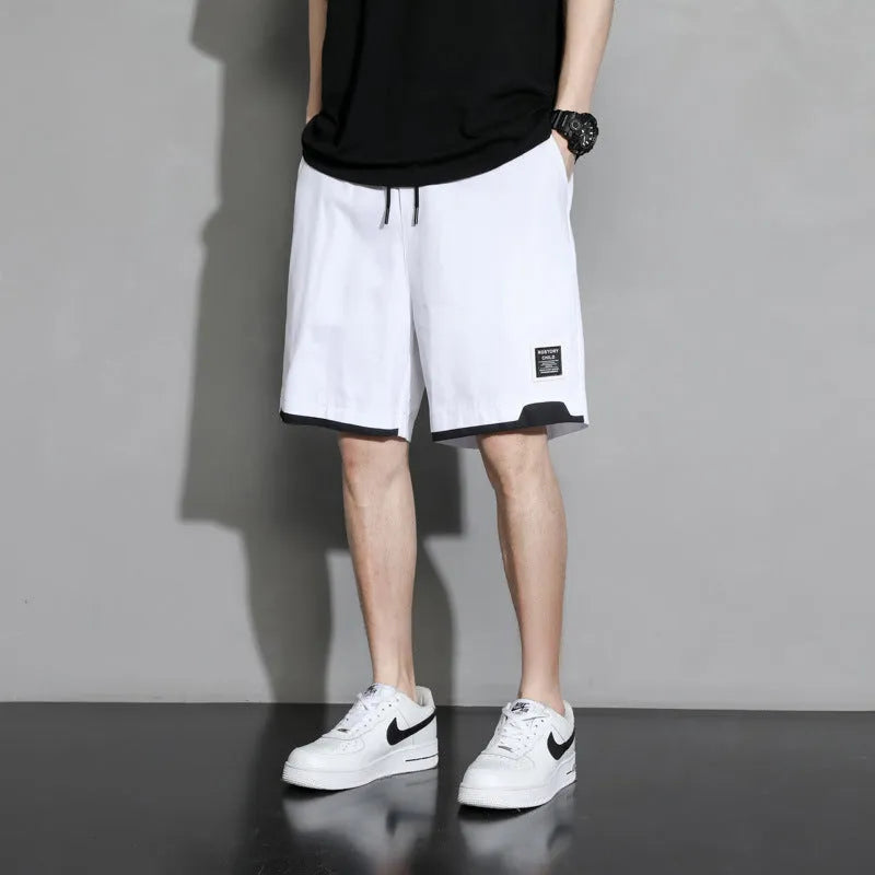 Boys' cotton summer shorts in sporty style available in black, khaki, and white colours