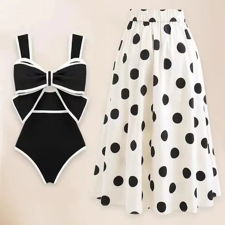 Female one-piece swim dress with round skirt and bow detail in polyester fabric