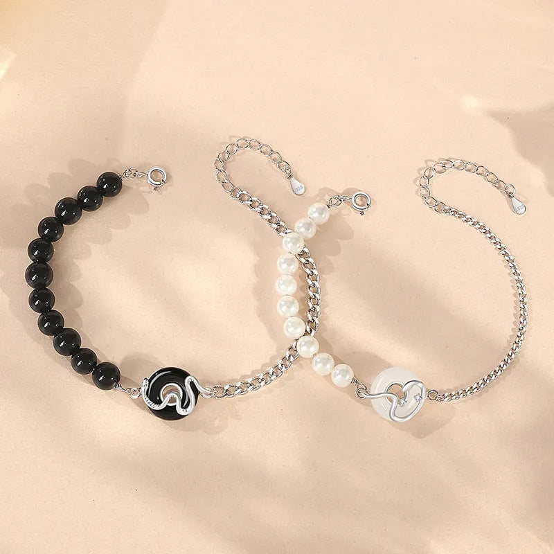 925 sterling silver couple bracelet with snake design and obsidian pearl accents on security buckle