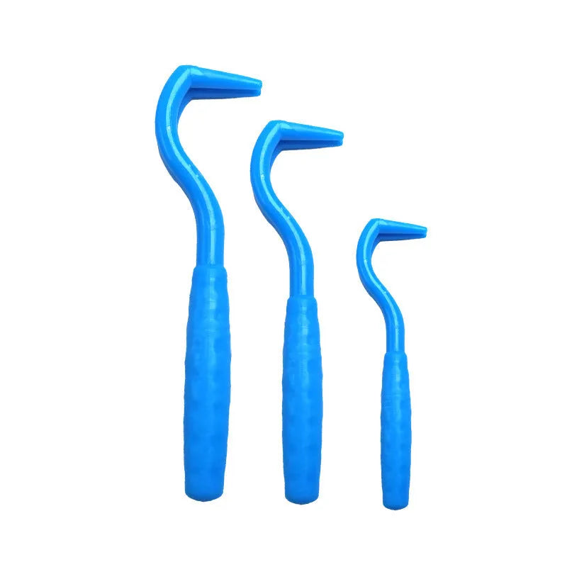 Set of three coloured ABS plastic tick removal hooks for dogs on a white background.