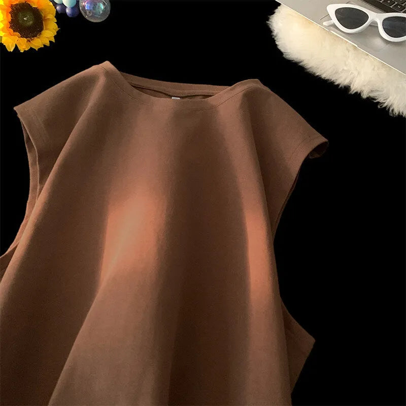 Men's loose cotton tank top in solid colours showing sleeveless design and straight hem