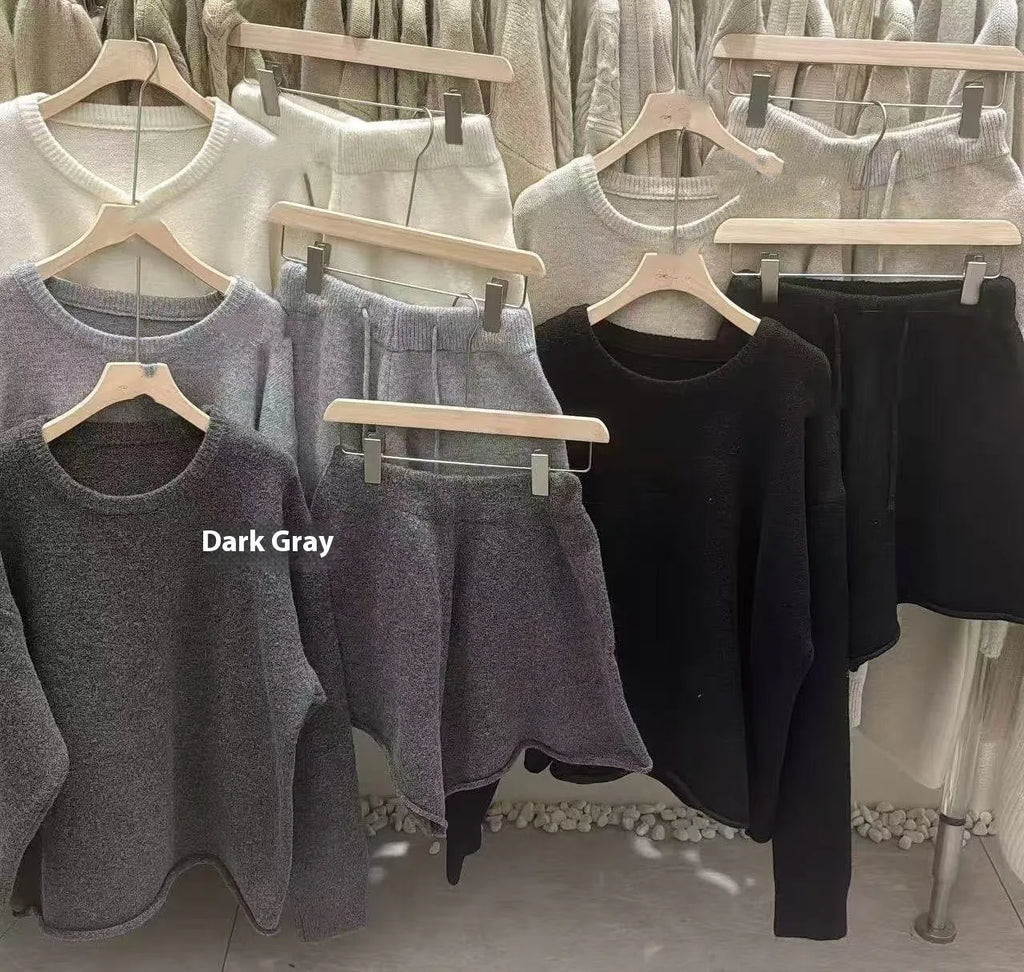 Women's loose grey knitted sweater and wide leg shorts two-piece loungewear set.